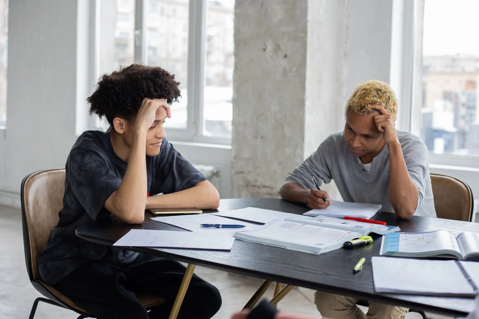 Two students reviewing study notes together